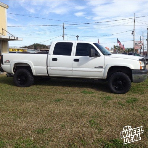 18x9 Rockstar II Black wheels 0mm wheels with 305/60/18 Mickey Thompson ATZP3 tires on a 2005 Chevy Silverado 2500HD 18x9" XD811 Rockstar II Black wheels 0mm wheels with 305/60/18 Mickey Thompson ATZP3 tires on a 2005 Chevy Silverado 2500HD