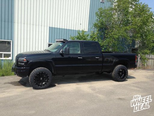 2007 GMC Sierra 2500 with 20x12" Moto Metal 962 Black Wheels with 33x12.50x20 Toyo Open Country MT Tires 20x12 Moto Metal 962 Black Wheels with 33x12.50x20 Toyo Open Country MT Tires on a 2007 GMC Sierra 2500