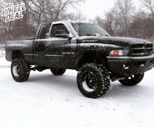 2001 Ram 1500 with 20x12" Moto Metal 962 Black wheels and 35x12.50x20 Nitto Trail Grappler tires 20x12 Black Moto Metal 962 wheels with 35x12.50x20 Nitto Trail Grappler tires on a 2001 Ram 1500