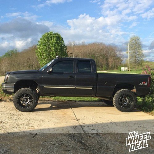 2003 Chevy Silverado 1500 with 20x12" Black XD Riot wheels with 35X12.50R20 Federal Couragia MT tires 20x12 KMC XD Riot Black wheels with 35X12.50R20 Federal Couragia MT tires on a 2003 Chevy Silverado 1500