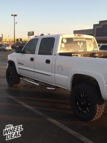 18x9 Moto Metal 962 Black wheels +0 with 285/65/18 Nitto Trail Grappler MT tires on a 2003 GMC Sierra 2500 18x9" Black Moto Metal 962 wheels +0 with 285/65/18 Nitto Trail Grappler MT tires on a 2003 GMC Sierra 2500