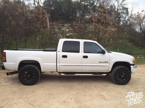 18x9 Black Moto Metal 962 wheels +0 with 285/65/18 Nitto Trail Grappler MT tires on a 2003 GMC Sierra 2500 18x9" Moto Metal 962 Black wheels +0 with 285/65/18 Nitto Trail Grappler MT tires on a 2003 GMC Sierra 2500
