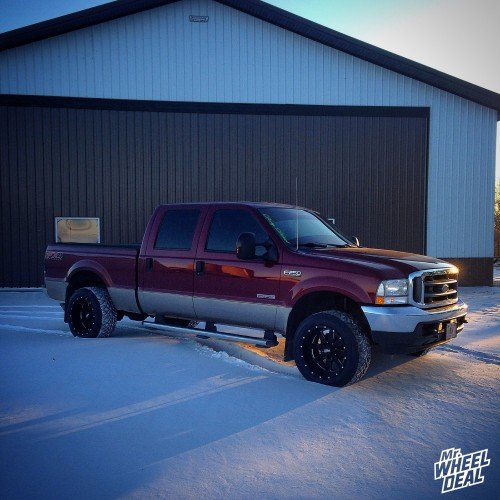 2004 Ford F-250 with 20x12" Moto Metal 962 Black wheels with 305/50/20 Nitto NT420S tires 20x12 Black Moto Metal 962 wheels with 305/50/20 Nitto NT420S tires on a 2004 Ford F250