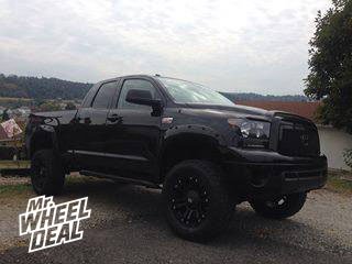 20x9" XD Monster Black Wheels with 35x12.50x20 Toyo Open Country AT II Tires on a 2012 Toyota Tundra