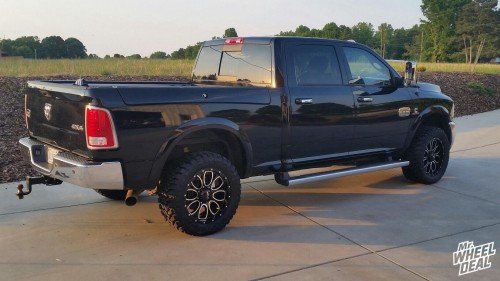 2014 Ram 3500 with 20x9 Helo HE879 Gloss Black and Milled wheels and 33x12.50x20 Toyo Open Country MT tires 20x9" Helo HE879 Gloss Black and Milled wheels with 33x12.50x20 Toyo Open Country MT tires on a 2014 Ram 3500