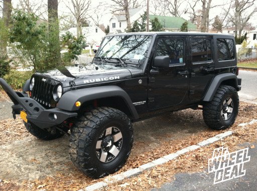 17x9" XD Rockstar Black & Machined Wheels with 37x13.50x17 Nitto Mud Grappler Tires on a 2012 Wrangler