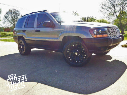 18x9 KMC XD Black Monster Wheels with 255/55/18 Toyo Open Country AT II Tires on a 2000 Jeep Cherokee 18x9 Black XD Monster Wheels with 255/55/18 Toyo Open Country AT II Tires on a 2000 Jeep Grand Cherokee