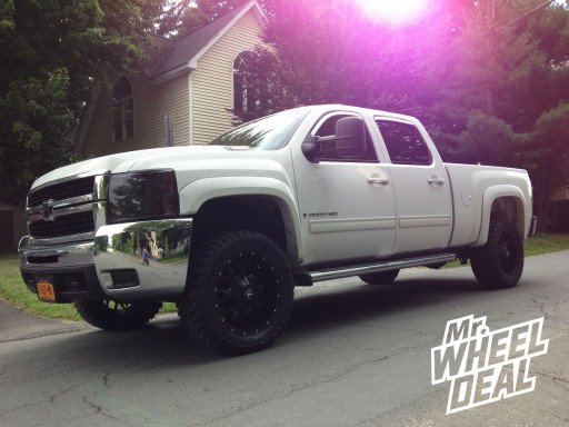 20x9" Dropstar 645B Wheels with 33x12.50x20 Toyo Open Country MT Tires on a 2009 Chevy Silverado 2500