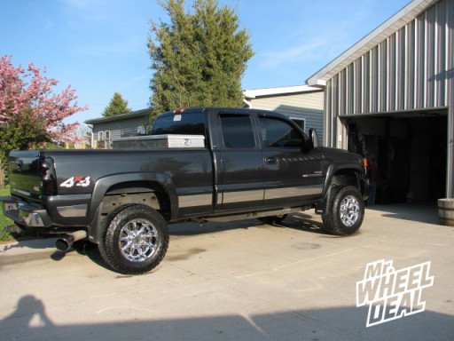 18x9" XD Badland Chrome Wheels with LT 285/65/18 Toyo Open Country AT II Tires on a GMC
