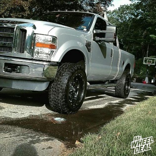 20x10" Fuel Hostage Black wheels with LT295/60R20 Nitto Terra Grappler G2 tires on a 2010 Ford F-350 20x10 Fuel Offroad Hostage Black wheels with LT295/60R20 Nitto Terra Grappler G2 tires on a 2010 Ford F350