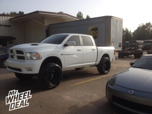 2012 Ram 1500 with 22x11 Fuel Hostage Wheels with 37X13.50R22 Nitto Mud Grappler Tires 22x11" Fuel Off-Rroad Hostage Wheels with 37X13.50R22 Nitto Mud Grappler Tires on a 2012 Ram 1500