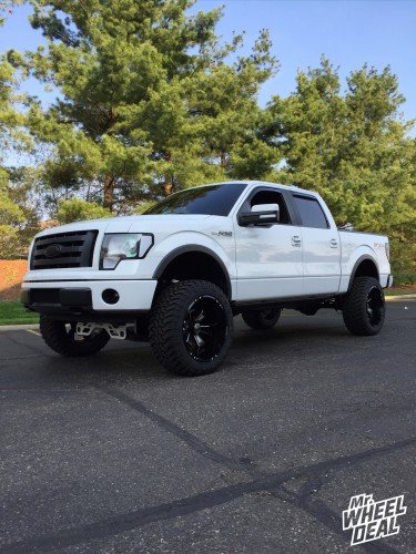 22x12" Hostile Hammered Blade Cut wheels with 35x12.50x22 Atturo Trail Blade tires on a 2009 Ford F-150 2009 Ford F-150 with 22x12 Hostile Hammered Blade Cut wheels and 35x12.50x22 Atturo Trail Blade tires