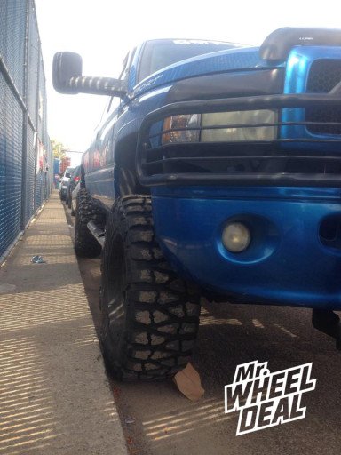 35x12.50x20 Nitto Mud Grappler Tires on a 1999 Dodge Ram 1500