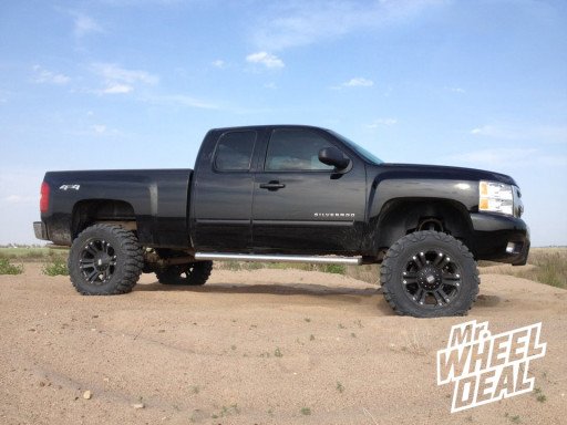 20x9" XD Monster Black Wheels with 35x12.50x20 Nitto Mud Grappler Tires on a 2011 Chevy 1500