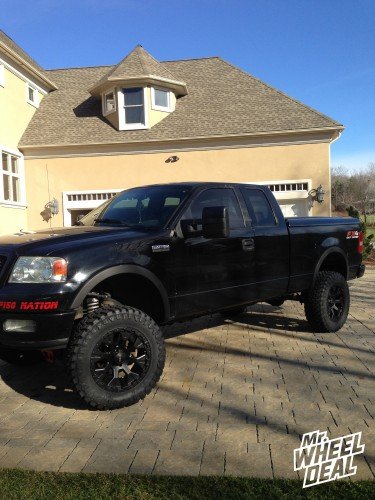 2004 Ford F-150 with 20x9 Helo HE878 Black -12 wheels and 35x12.50r20 Atturo Trail Blade MT tires 20x9" Helo HE878 Black -12 wheels with 35x12.50r20 Atturo Trail Blade MT tires on a 2004 Ford F-150