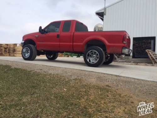 1999 Ford F-250 with 20x14 XD Riot Chrome wheels with 35x12.50r20 Nitto Terra Grappler G2 tires Chrome 20x14 XD Riot wheels with 35x12.50r20 Nitto Terra Grappler G2 tires on a 1999 Ford F-250