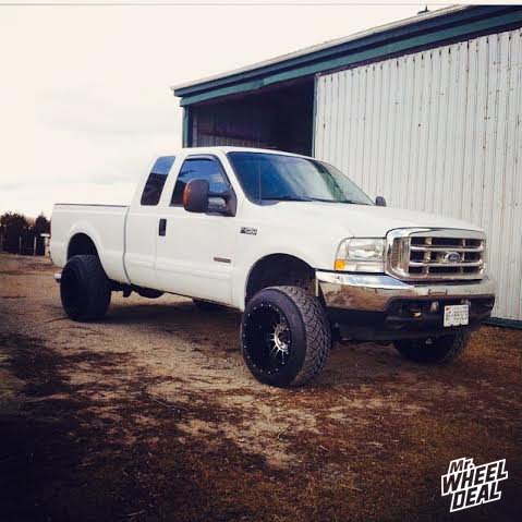 20x14" KMC XD Riot 809 Black wheels with 305/50/20 Nitto Trail Grappler 420s tires on a 2004 Ford F250 20x14 XD Series Riot 809 Black wheels with 305/50/20 Nitto Trail Grappler 420s tires on a 2004 Ford F250