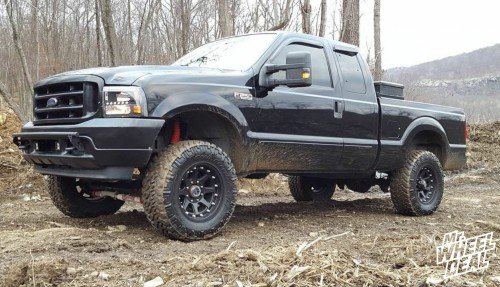 2003 Ford F-250 with 18x9" Black XD Addict wheels and 295x70x18 Nitto Trail Grappler MT tires 18x9" XD Addict Black wheels with 295x70x18 Nitto Trail Grappler MT tires on a 2003 Ford F250
