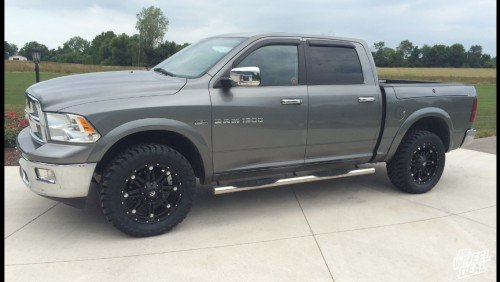 2011 Ram 1500 with Black 20x9 Fuel Hostage wheels and 33x12.50x20 Toyo Open Country MT tires 20x9 Black Fuel Off-Road Hostage wheels with 33x12.50x20 Toyo Open Country MT tires on a 2011 Ram 1500
