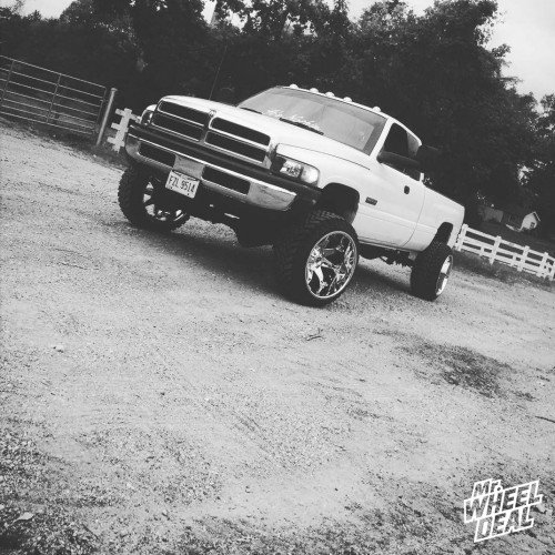 2002 Ram 2500 with 22x14 Fuel Off-Road Octane wheels and 33x12.50x22 Atturo Trail Blade MT tires 22x14 Fuel Offroad Octane wheels with 33x12.50x22 Atturo Trail Blade MT tires on a 2002 Ram 2500