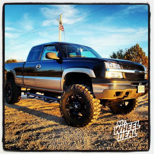 20x10" XD Rockstar Black Wheels with 37x13.50x20 Nitto Mud Grappler Tires on a 2003 Chevy 1500
