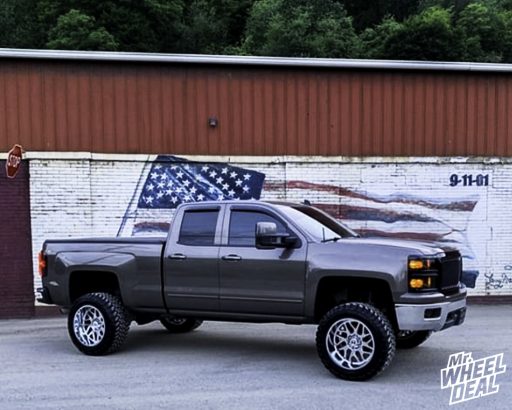 2015 Chevy Silverado 1500 with 20x12 -44mm Chrome Hostile Sprocket wheels and 33x12.50R20LT Toyo Open Country MT tires