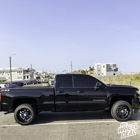 2018 Chevy Silverado 1500 with 20x12 Hostile Demon -44mm Black wheels and LT285/50R20 Atturo Trail Blade MT tires