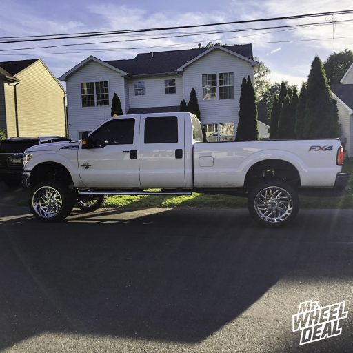 2012 Ford F-250 with 24x14 TIS 544V -76mm PVD Chrome wheels and 35x13.50R24 AMP Mud Terrain Attack MT A tires