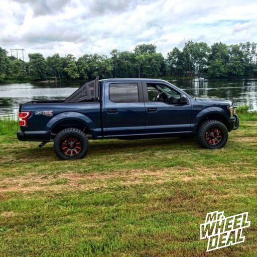 20x10" Fuel Off-Road Hardline Black Red wheels with 33X12.50R20/10 Ironman All Country MT tires on a 2018 Ford F-150