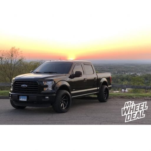 22x12" XD826 Surge -44mm Black Milled wheels with 305/40R22 Nitto NT420S tires on a 2015 Ford F-150