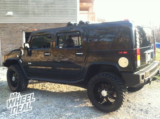22x9.5" Milanni Kool Whip 8 Wheels with 325/50/22 Nitto Trail Grappler MT Tires on a 2003 Hummer H2