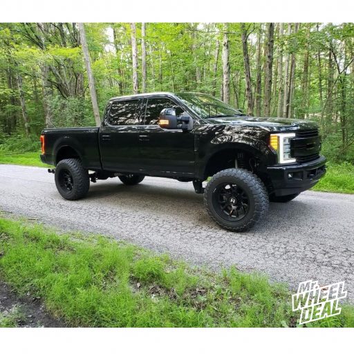 22x12 Black Hostile Rage -44mm wheels with 37X13.50R22LT Toyo Open Country MT tires on a 2017 Ford F250